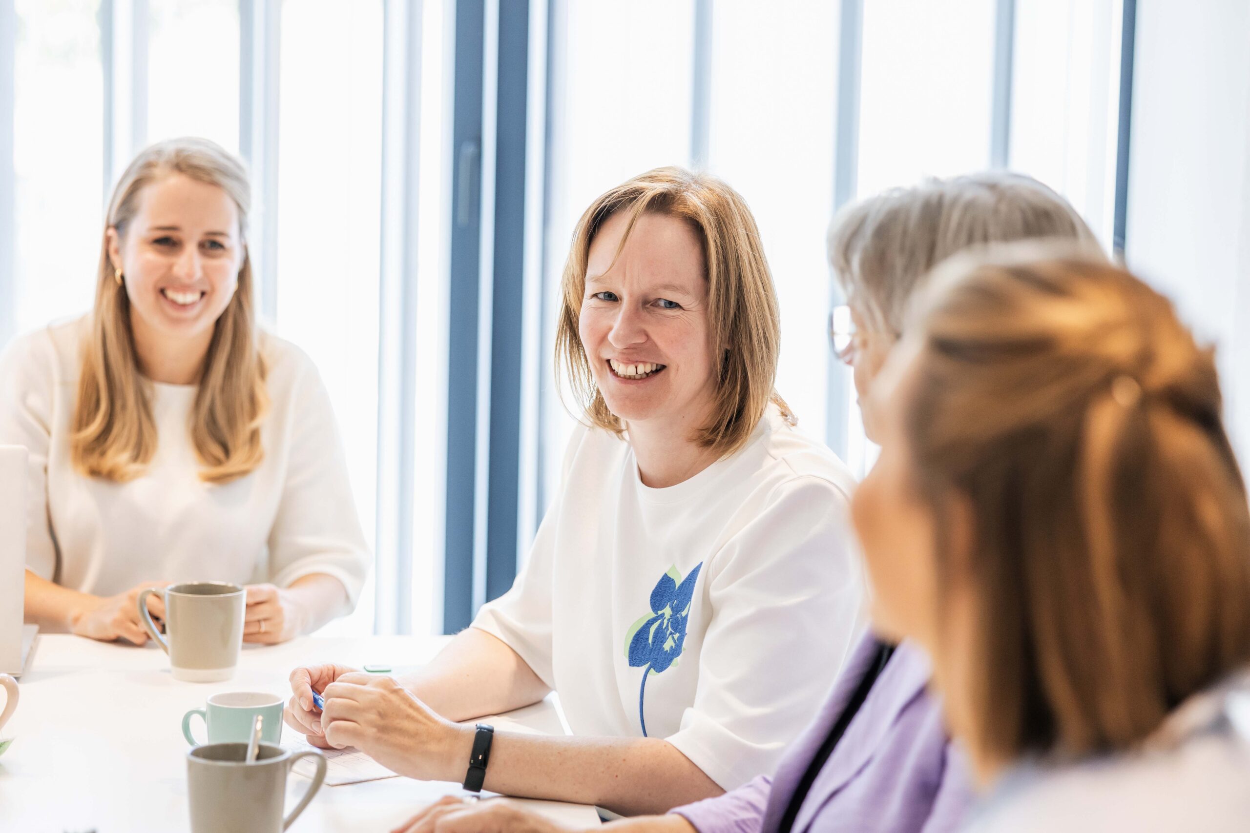 Motivated team in conversation at attendo professional